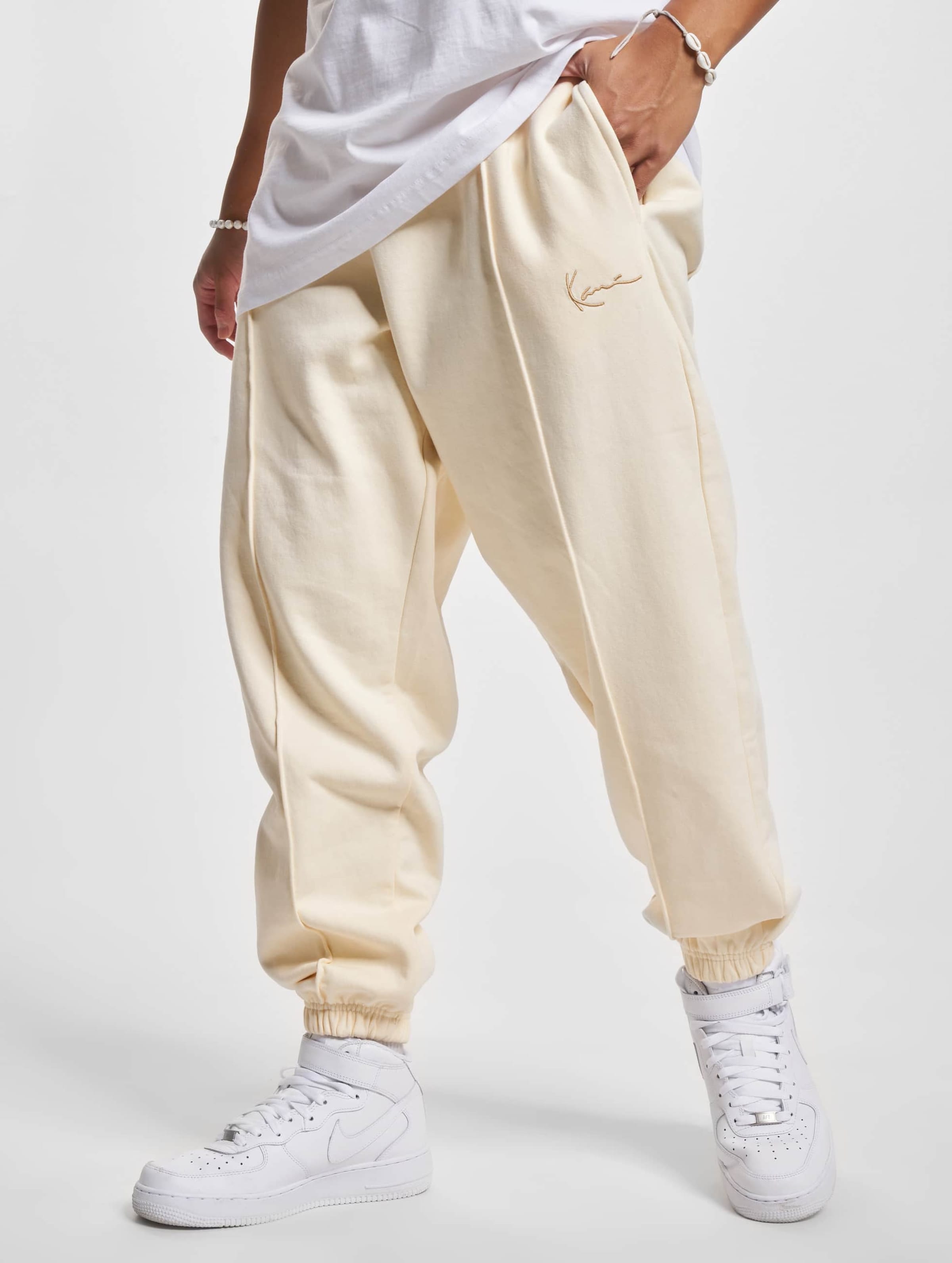 Nike mini metallic swoosh oversized joggers in cream hot sale