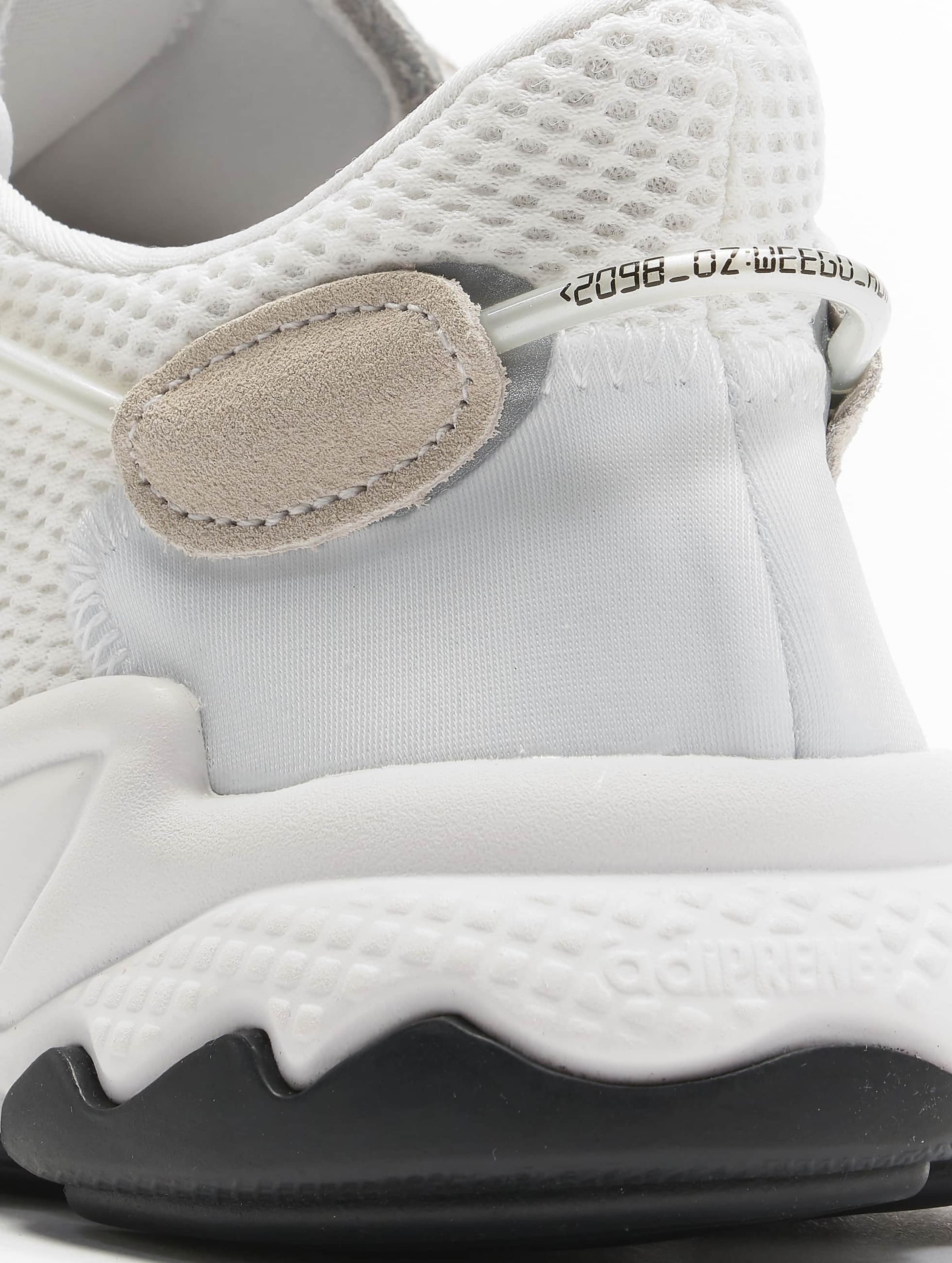 Adidas originals ozweego hotsell sneakers in triple white