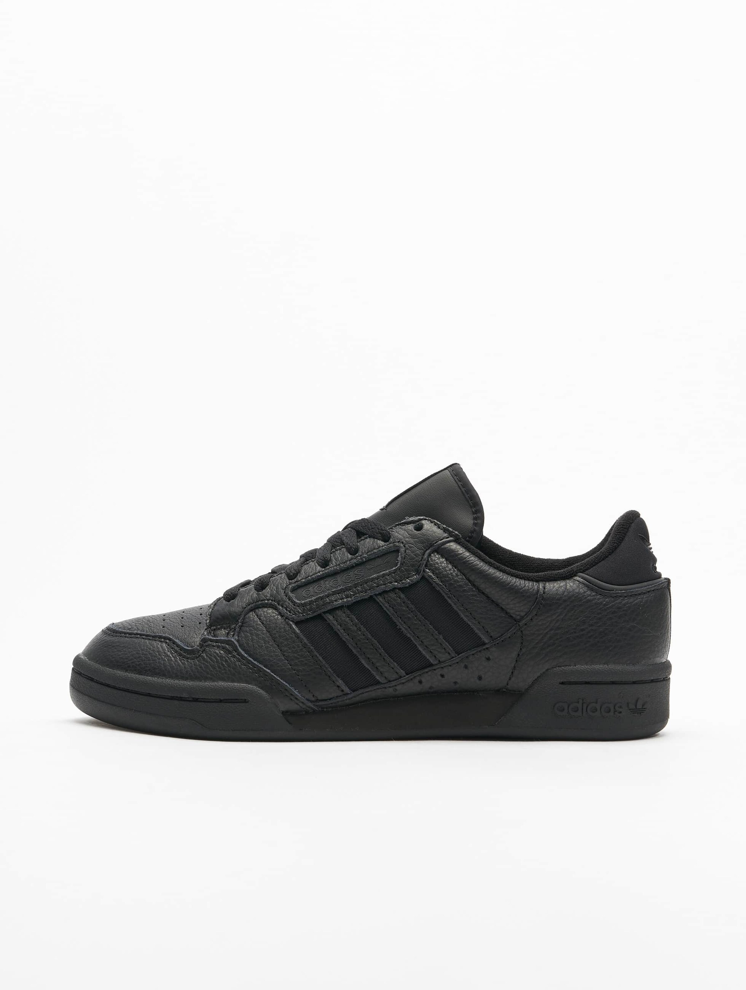 All black adidas continental on sale